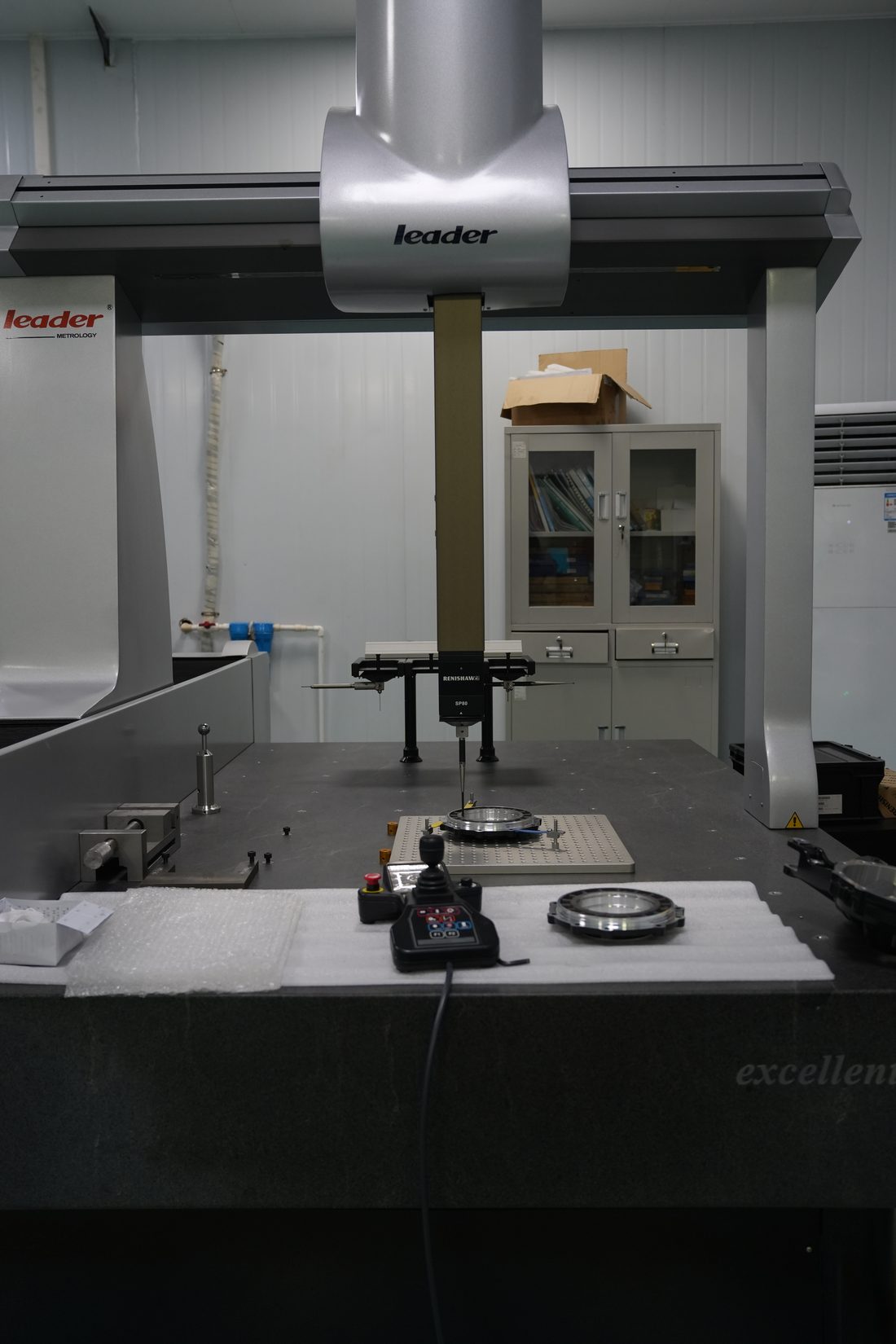 Coordinate measuring machine inspecting precision parts